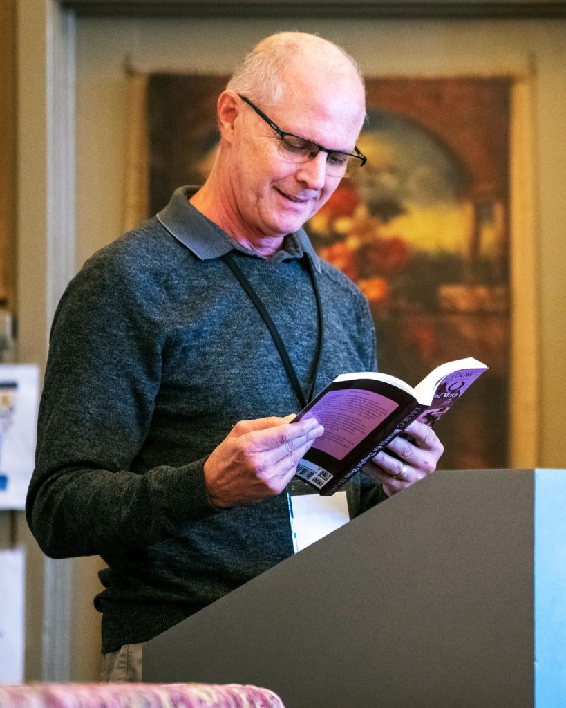 Man reading from a book