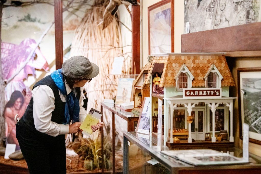 Woman examining a museum display