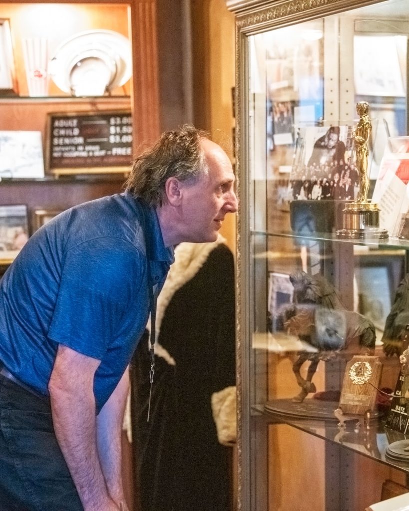 Man examining a museum display