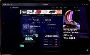A laptop screen showing results of an internet speed test