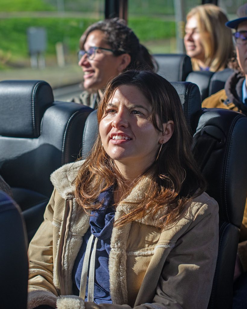 A woman on a bus in bright sun