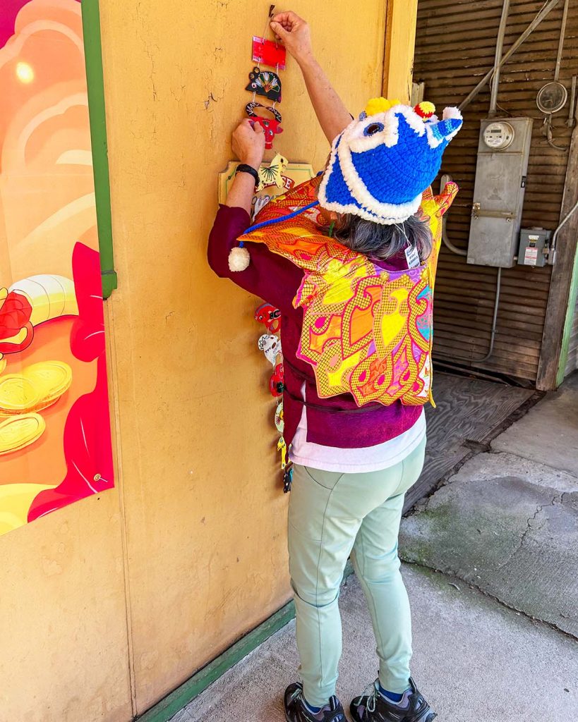 A woman hanging a decoration