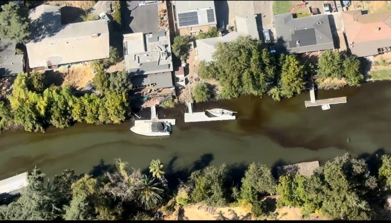 Aerial shot of a petroleum spill in a canal