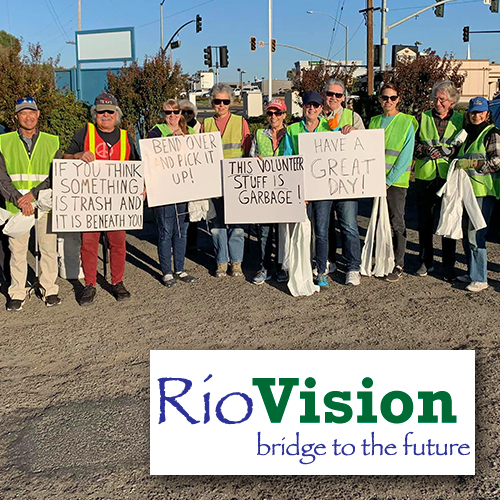 RioVision (people with fluorescent vests holding up hand-written signs)