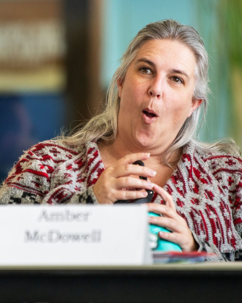 A woman expresses shock at something she just heard