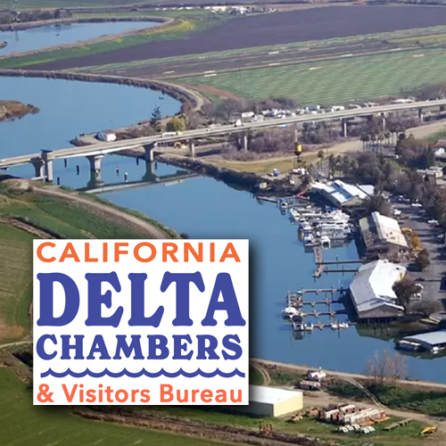 California Delta Chambers (aerial view of marinas near a bridge over a river)