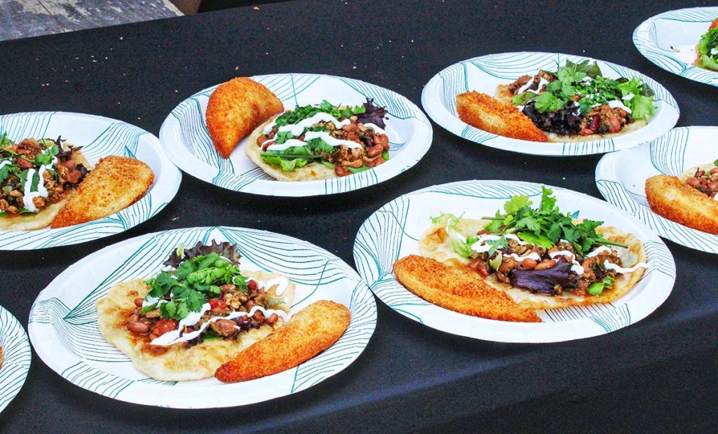 Lunch laid out on paper plates