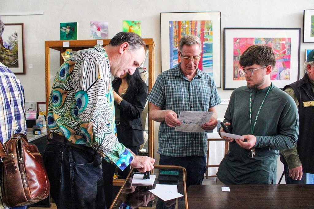 A man stamps a piece of paper